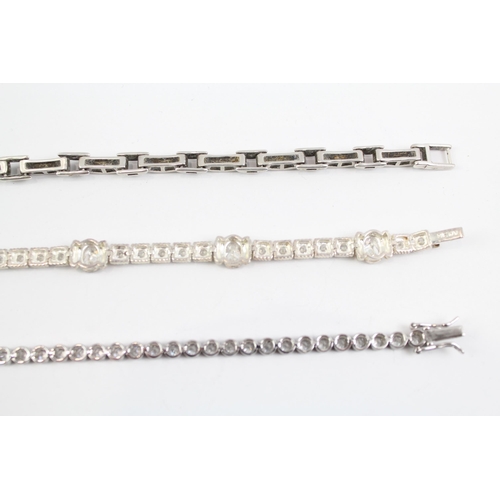 2100 - Three sterling silver CZ bracelets to include tennis etc. - approx. gross weight 48g