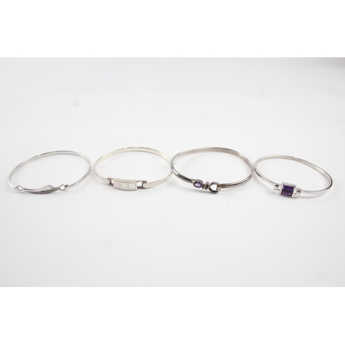 2105 - Four sterling silver gemstone bangles to include diamond, amethyst etc. - approx. gross weight 45g