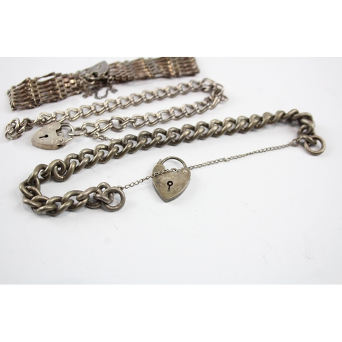 2107 - Three sterling silver gate bracelets with heart padlock clasps - approx. gross weight 52g