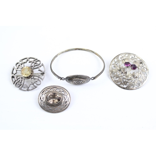 2111 - Four sterling silver jewellery items to include Scottish, gemstone, paste etc. - approx. gross weigh... 