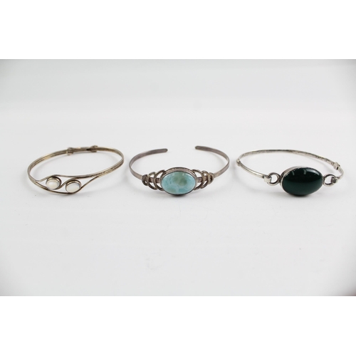 2114 - Three sterling silver gemstone bangles to include moonstone, larimar etc. - approx. gross weight 37g