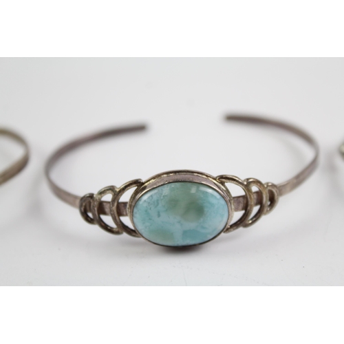 2114 - Three sterling silver gemstone bangles to include moonstone, larimar etc. - approx. gross weight 37g