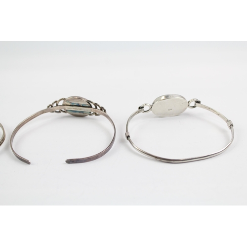 2114 - Three sterling silver gemstone bangles to include moonstone, larimar etc. - approx. gross weight 37g