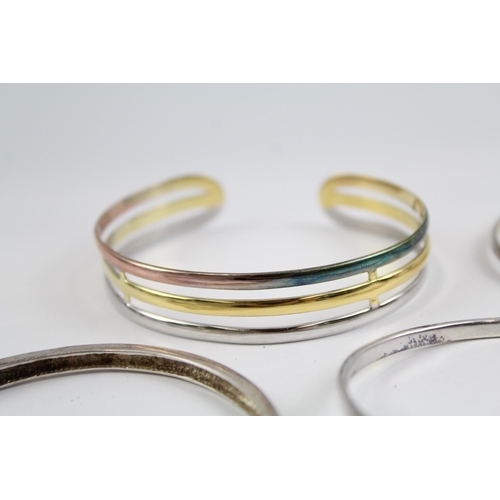 2118 - Four sterling silver bangles to include multi row, heart, Celtic etc. - approx. gross weight 49g