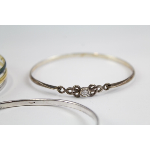 2118 - Four sterling silver bangles to include multi row, heart, Celtic etc. - approx. gross weight 49g