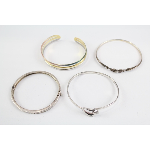 2118 - Four sterling silver bangles to include multi row, heart, Celtic etc. - approx. gross weight 49g