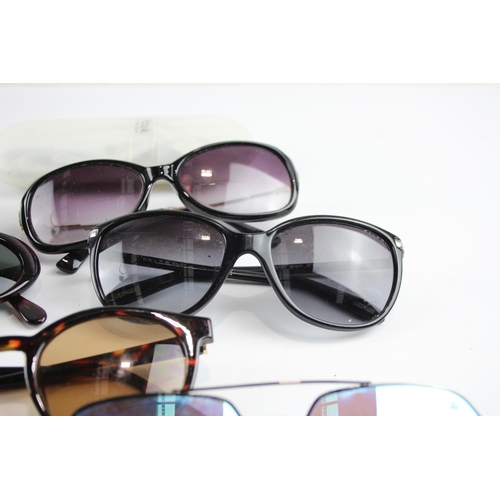 356 - Eight pairs of cased designer sunglasses and glasses