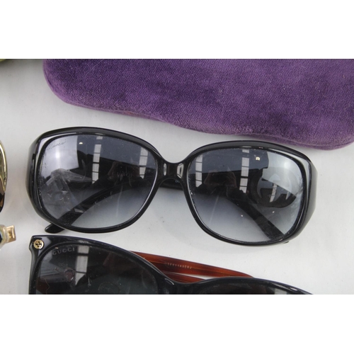 371 - Four pairs of cased designer sunglasses and glasses to include Gucci, Chloe etc.