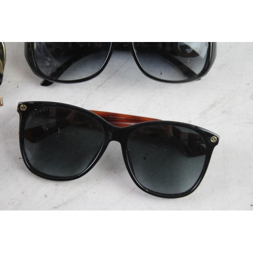 371 - Four pairs of cased designer sunglasses and glasses to include Gucci, Chloe etc.