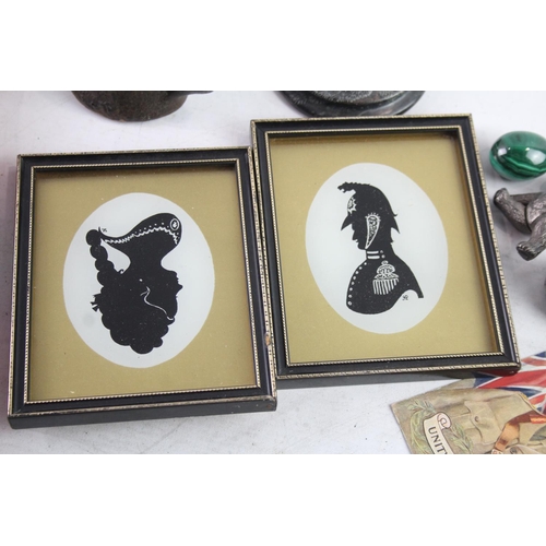 414 - Ten collectable items to include two framed silhouette pictures, post card, Christmas decorations et... 