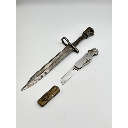 2533 - Three military items, one J. Thompson (Cutlery) Ltd Sheffield pocket knife with Broad arrow mark and... 