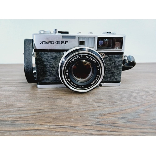 10 - A cased Olympus 35 SP spot and center-weighted metering 35mm rangefinder camera fitted with G. Zuiko... 