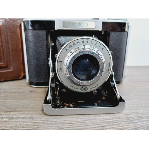 12 - A cased mid 20th century Agilux Agifold folding rangefinder camera for 6x6 images on 120 film fitted... 