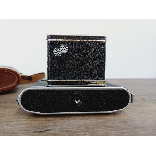 12 - A cased mid 20th century Agilux Agifold folding rangefinder camera for 6x6 images on 120 film fitted... 