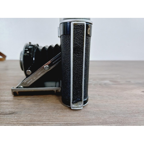 12 - A cased mid 20th century Agilux Agifold folding rangefinder camera for 6x6 images on 120 film fitted... 