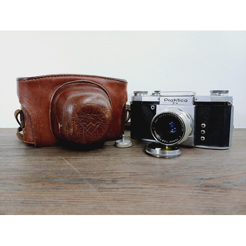 16 - A cased 1950s KW Praktica FX M42 mount, waist-level finder 35mm SLR camera fitted with Carl Zeiss Te... 