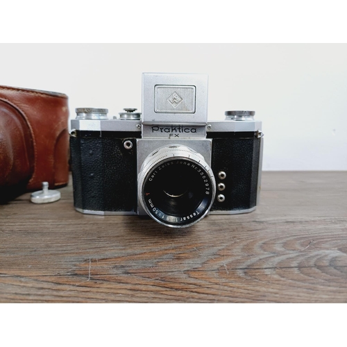 16 - A cased 1950s KW Praktica FX M42 mount, waist-level finder 35mm SLR camera fitted with Carl Zeiss Te... 