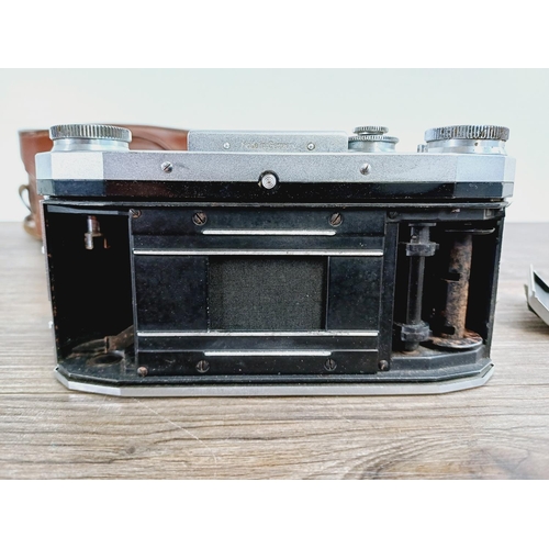 16 - A cased 1950s KW Praktica FX M42 mount, waist-level finder 35mm SLR camera fitted with Carl Zeiss Te... 