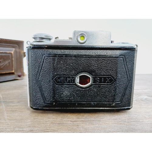 6 - A cased early 1950s Taisei Kōki K.K. Welmy Six W double viewfinder folding camera (serial no. 33451)... 