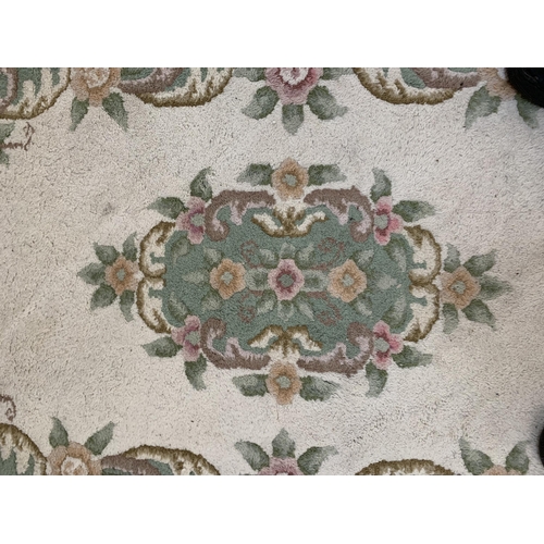 63 - Three Chinese woollen floral pattern rugs