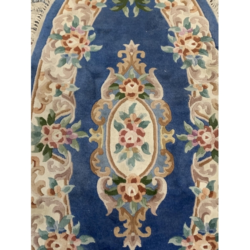 63 - Three Chinese woollen floral pattern rugs