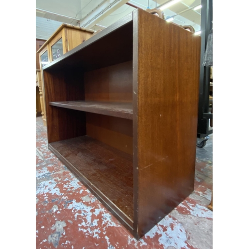 82 - A mahogany effect two tier bookcase - approx. 63cm high x 90cm wide x 35cm deep