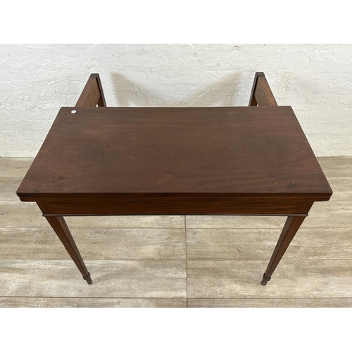 177 - A Georgian mahogany fold over tea table - approx. 71cm high x 93cm wide x 93cm deep