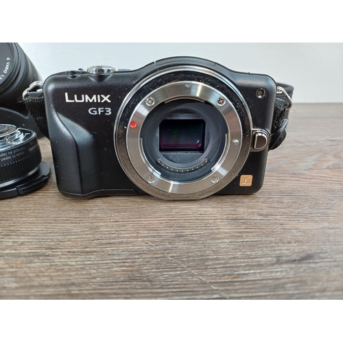 18 - A Panasonic Lumix DMC-GF3 Micro Four Thirds 12mp mirrorless digital system camera fitted with G 1:2.... 