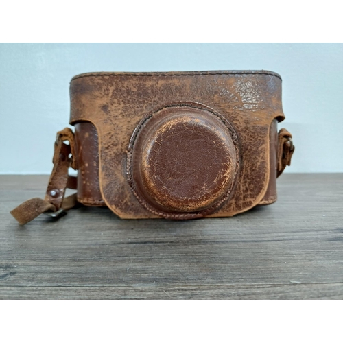 21 - A cased 1950s K.G. Corfield Ltd. Periflex (second version) 35mm viewfinder camera fitted with 39mm s... 