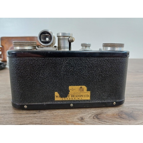 21 - A cased 1950s K.G. Corfield Ltd. Periflex (second version) 35mm viewfinder camera fitted with 39mm s... 