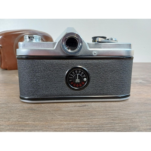 26 - A cased late 1950s/early 1960s Chiyoda Kogaku Minolta SR-1 (second version) 35mm SLR camera fitted w... 