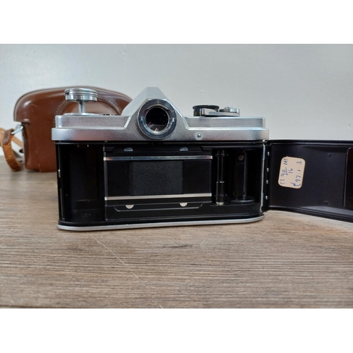 26 - A cased late 1950s/early 1960s Chiyoda Kogaku Minolta SR-1 (second version) 35mm SLR camera fitted w... 