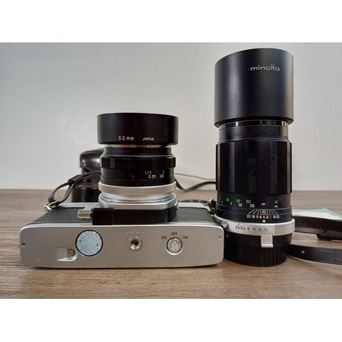 29 - A cased Minolta SRT101 35mm SLR camera fitted with MC Rokkor-PF 1:1.7 f=55mm lens with cased MC Tele... 