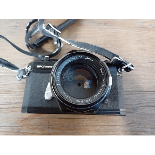 35 - A cased 1970s Asahi Pentax Spotmatic SPII 35mm SLR camera fitted with Super-Multi-Coated Takumar 1:1... 