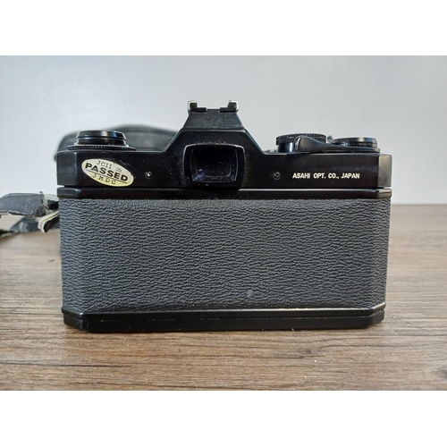 35 - A cased 1970s Asahi Pentax Spotmatic SPII 35mm SLR camera fitted with Super-Multi-Coated Takumar 1:1... 