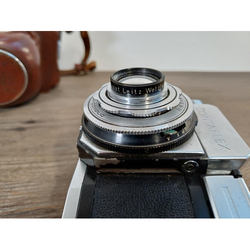 36 - A cased mid 1950s Zeiss Ikon Contaflex II 35mm SLR camera fitted with Tessar 1:2.8 45mm lens, Synchr... 