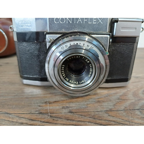 36 - A cased mid 1950s Zeiss Ikon Contaflex II 35mm SLR camera fitted with Tessar 1:2.8 45mm lens, Synchr... 