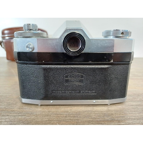 36 - A cased mid 1950s Zeiss Ikon Contaflex II 35mm SLR camera fitted with Tessar 1:2.8 45mm lens, Synchr... 