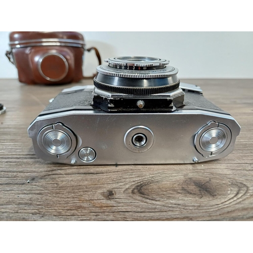 36 - A cased mid 1950s Zeiss Ikon Contaflex II 35mm SLR camera fitted with Tessar 1:2.8 45mm lens, Synchr... 