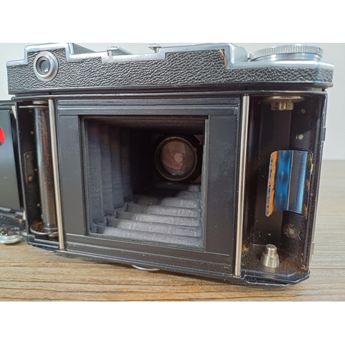 40 - A cased mid 20th century Zeiss Ikon Super Ikonta 532/16 folding rangefinder camera (serial no. A3323... 