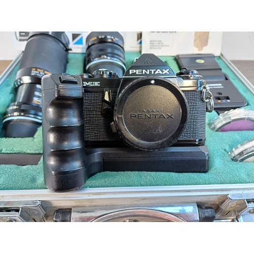 44 - An aluminium flight case containing Asahi Pentax ME 35mm SLR camera body fitted with ME II Winder, T... 