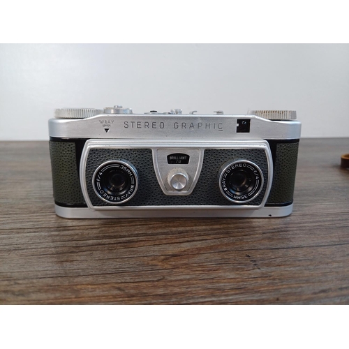 49 - A part cased late 1950s Wray Stereo Graphic 35mm stereo camera fitted with Wray f/4 35mm lenses (ori... 