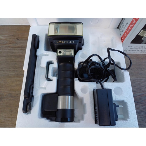 51 - A boxed Metz Mecablitz 45 CL-4 digital handle-mount hammerhead flash