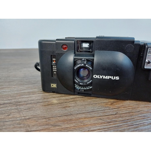 54 - An Olympus XA4 Macro ultra-compact 35mm viewfinder camera fitted with A11 flash