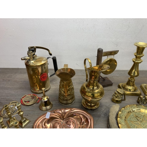 292 - A collection of metalware to include Arts and Crafts copper crumb brush and tray, pair of brass cand... 