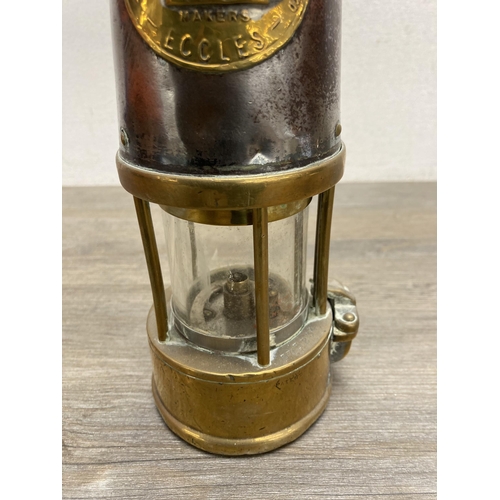 294 - An early 20th century The Protector Lamp & Lighting Co Ltd of Eccles Type SL brass and steel miner's... 