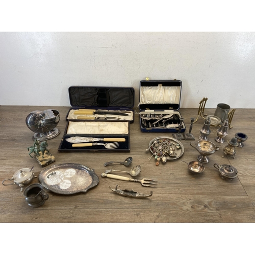 298 - A collection of metalware to include six Continental various graded silver collector's spoons, white... 