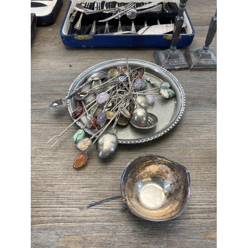 298 - A collection of metalware to include six Continental various graded silver collector's spoons, white... 