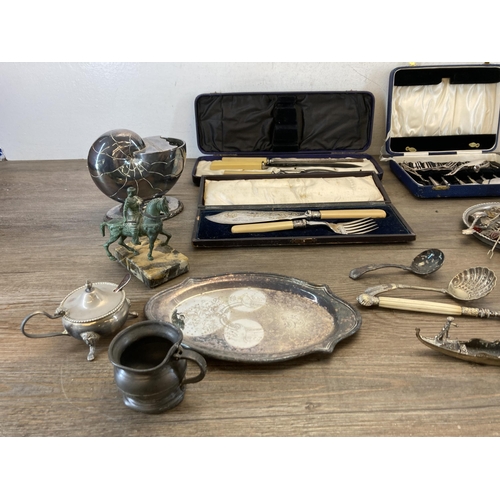 298 - A collection of metalware to include six Continental various graded silver collector's spoons, white... 