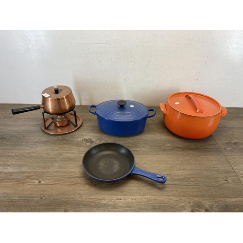 302 - Four pieces of metalware, one Le Creuset blue enamelled cast iron frying pan, one Le Creuset no. 25 ... 